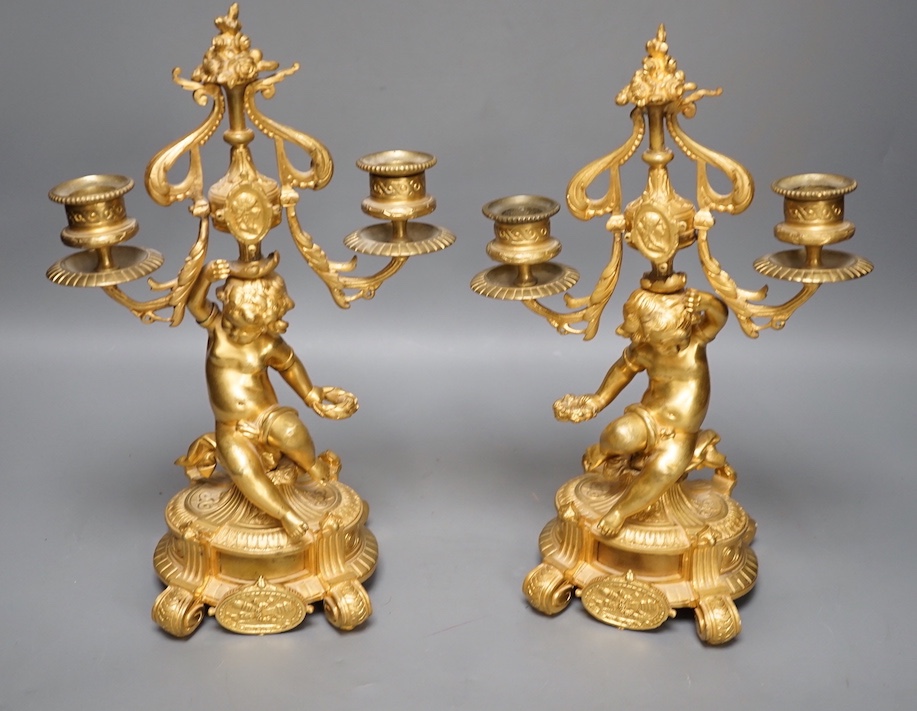 A pair of Louis XVI ormolu cherub candelabra 31cm